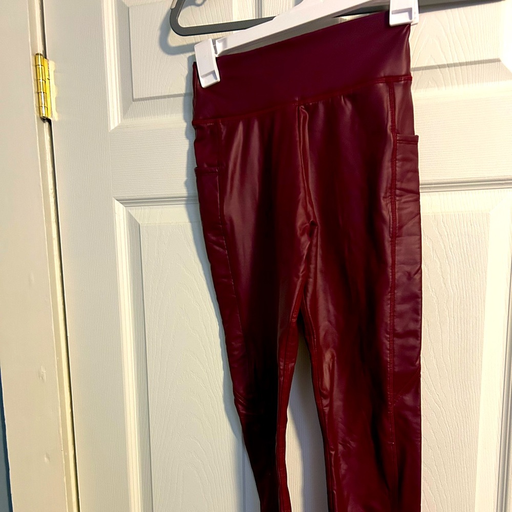 Red faux leather leggings with pockets